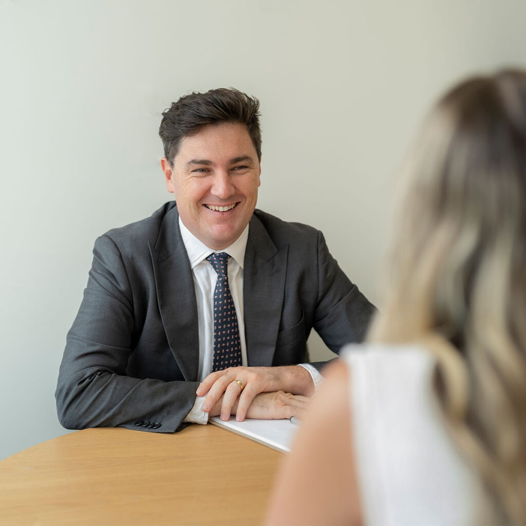 lawyer laughing with client