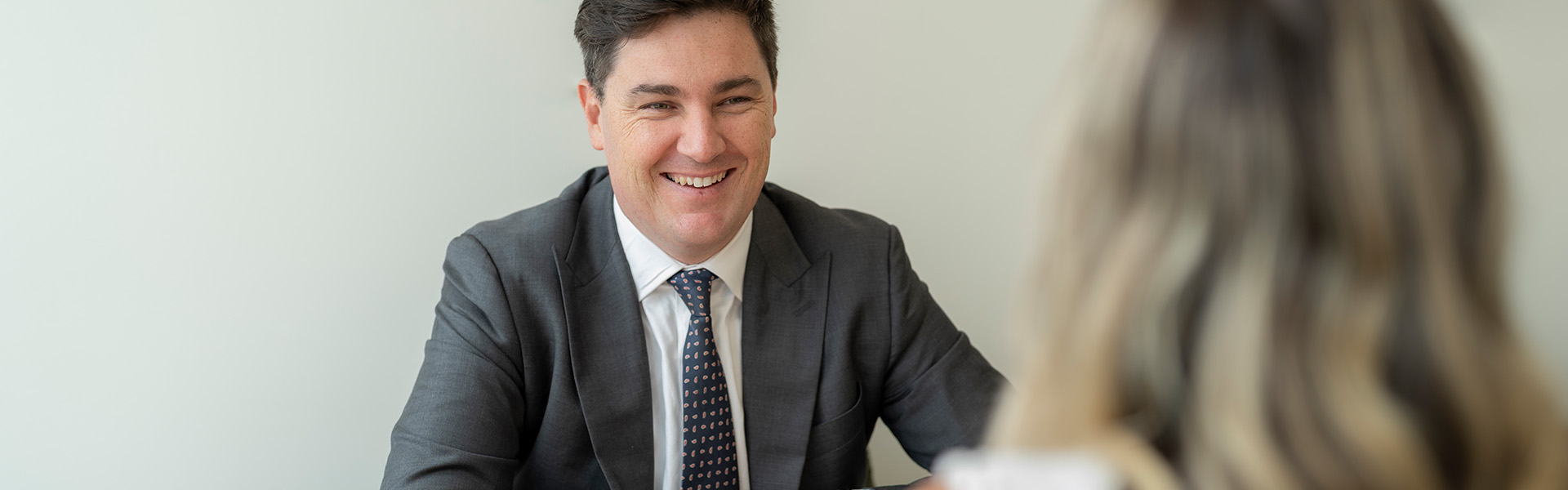 man smiling at woman