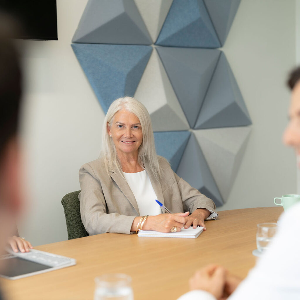 woman smiling during discussion
